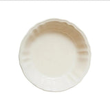 Il Buco Flora small serving bowl in cream ceramic with a scalloped edge inspired by 18th-century Italian design.