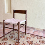Calimia Home Gaon chair featuring a dark walnut oak frame and a woven cream leather seat in a modern minimalist style.