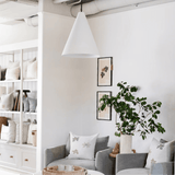 Fenn Chairs in grey linen with the Round Ottoman beneath a Grazia Pendant in the Calimia Home showroom