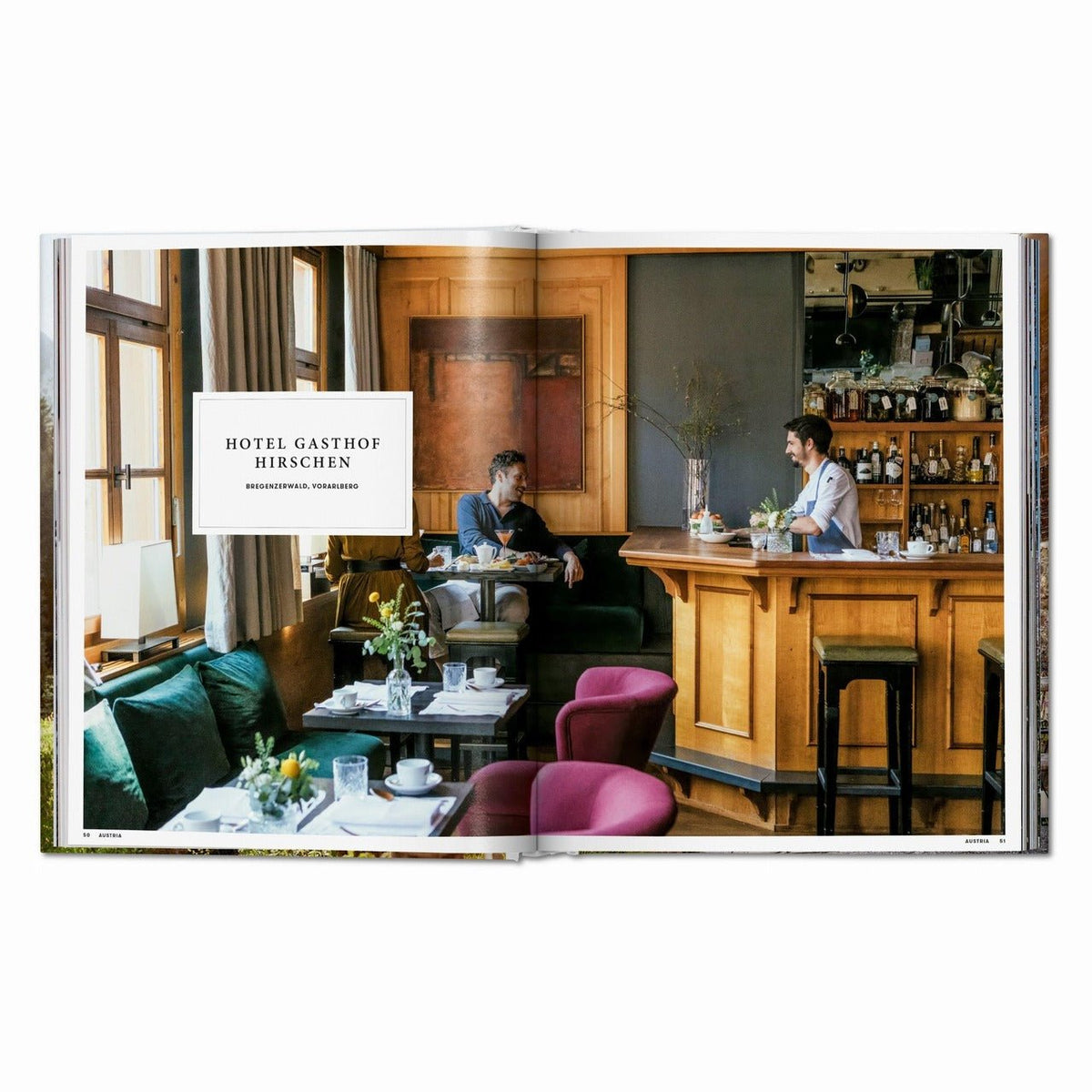 Calimia Home Great Escapes Alps book open to the Hotel Gasthof Hirschen spread with a wood-panelled bar and dining room.