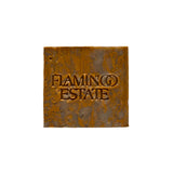 The marbled olive and amber Green Goddess Soap Bar from Flamingo Estate, embossed with the brand wordmark, photographed centered on a white backdrop.