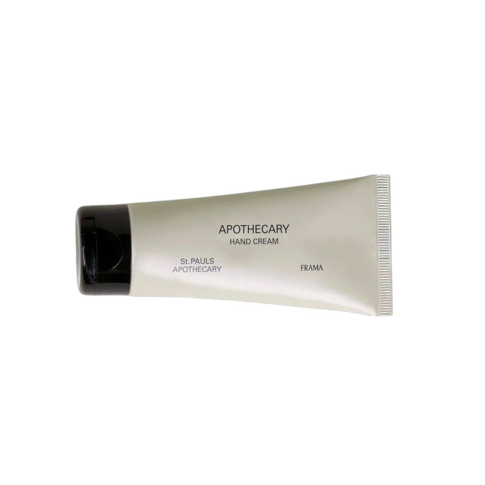 Frama Apothecary hand cream in a minimalist sage green tube with black cap, featuring sandalwood and cedar.