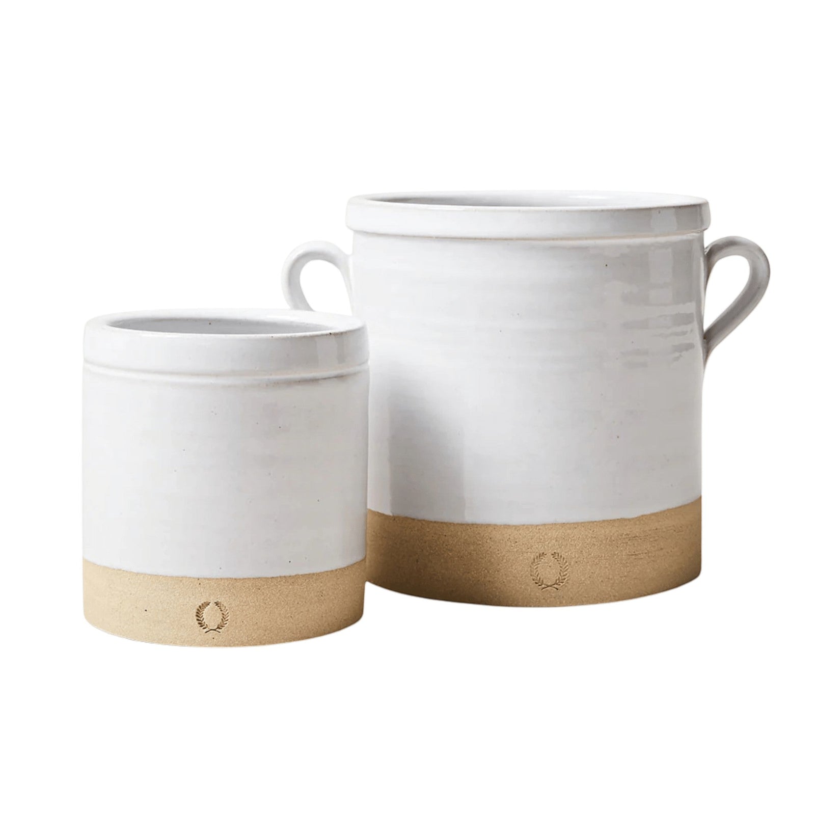 Farmhouse Pottery Silo Crocks in white glazed ceramic with natural stoneware bases and decorative laurel leaf stamps.