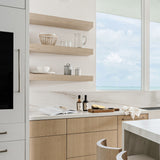 Calimia Home hand-blown clear recycled glass rock glass on a modern kitchen shelf