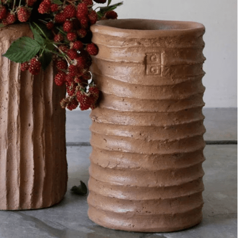 Calimia Home handmade terracotta cement vase with a ribbed texture and rustic finish for indoor or outdoor decor.