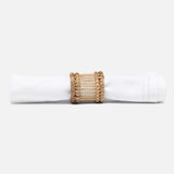 Napkin rings styled with linen on a dining table