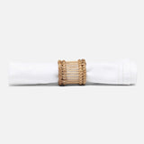 Napkin rings styled with linen on a dining table