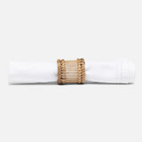 Napkin rings styled with linen on a dining table