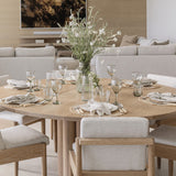 Pom Pom At Home Healdsburg Napkins in ocean blue with thin stripes and fringe edges set on a round wooden dining table