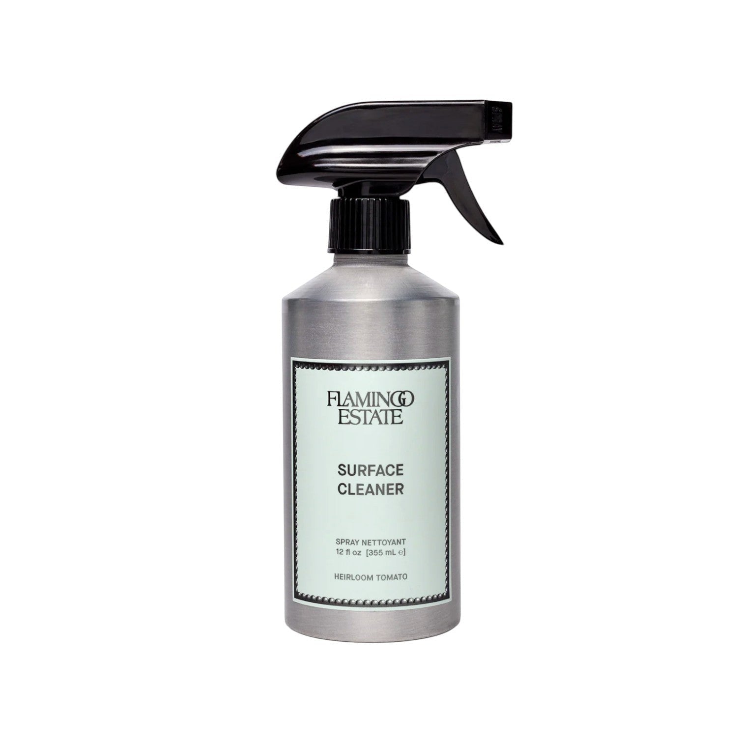Calimia Home Heirloom Tomato surface cleaner in a silver metal spray bottle with a black trigger nozzle.
