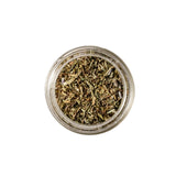 Calicutts Herbes de Provence spice blend in a small glass jar, featuring dried thyme, lavender, and rosemary.