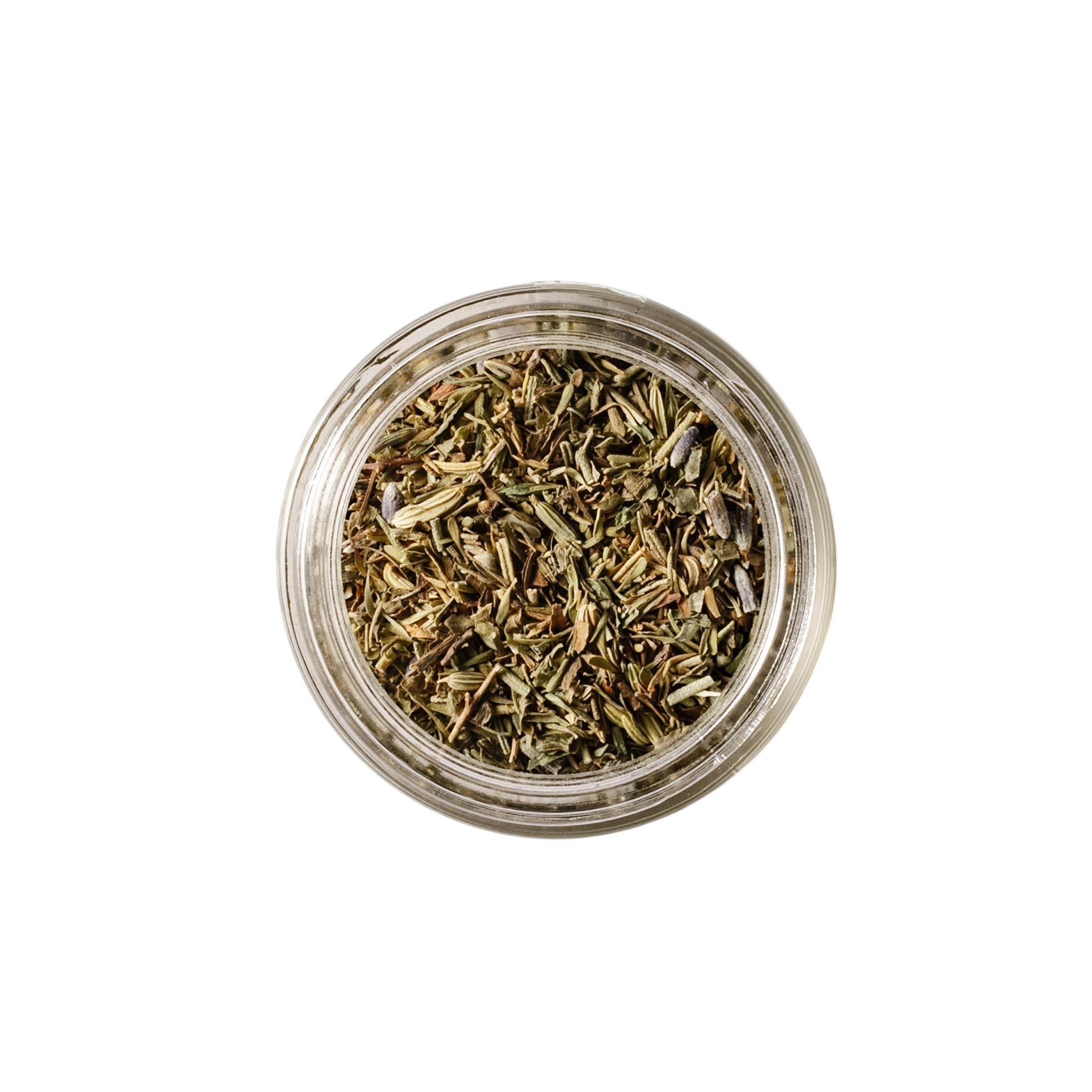Calicutts Herbes de Provence spice blend in a small glass jar, featuring dried thyme, lavender, and rosemary.
