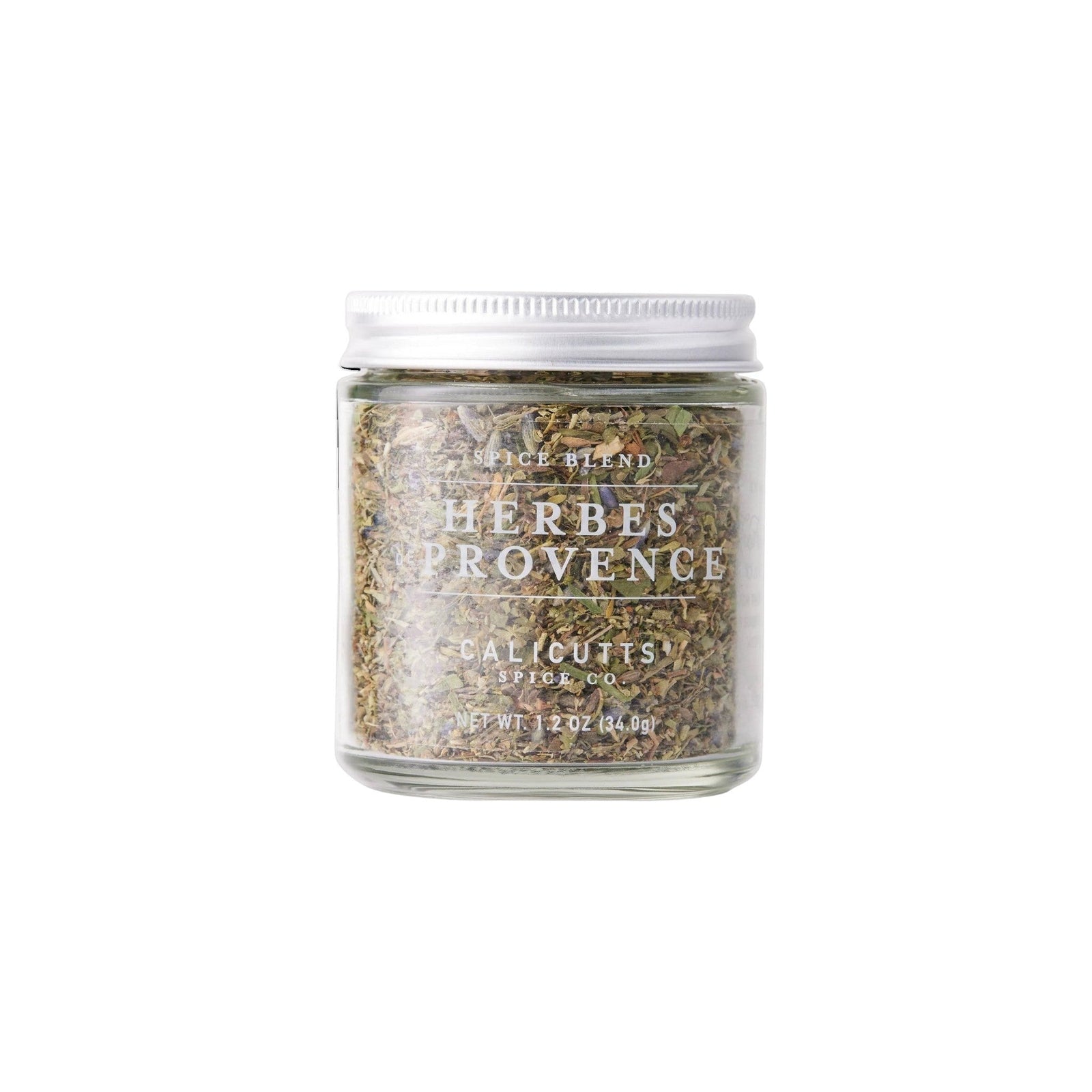 Calicutts Herbes De Provence spice blend in a clear glass jar with a silver lid, featuring dried thyme and lavender.