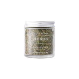 Calicutts Herbs Blend in a clear glass jar with a silver lid, containing a mix of premium dried aromatic herbs.
