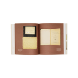Open book with yellowed pages on a white background
