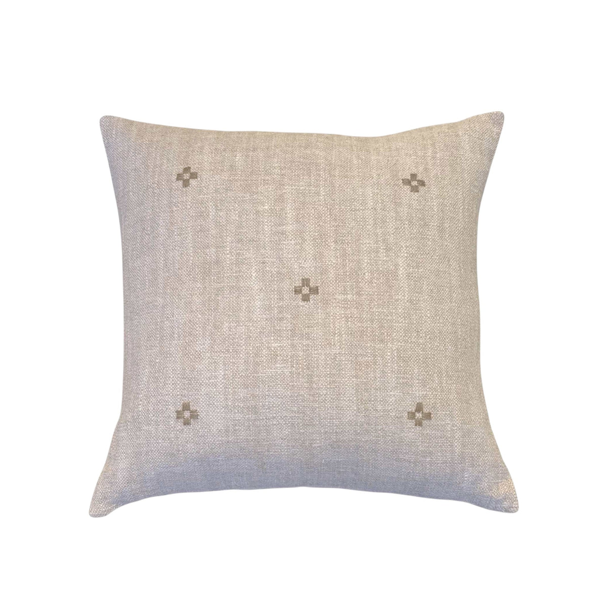 Isak Taupe Pillow by One Bi One — hand-embroidered Belgian linen in caramel taupe, available in 18×15" and 16×16", handcrafted in Gothenburg, Sweden