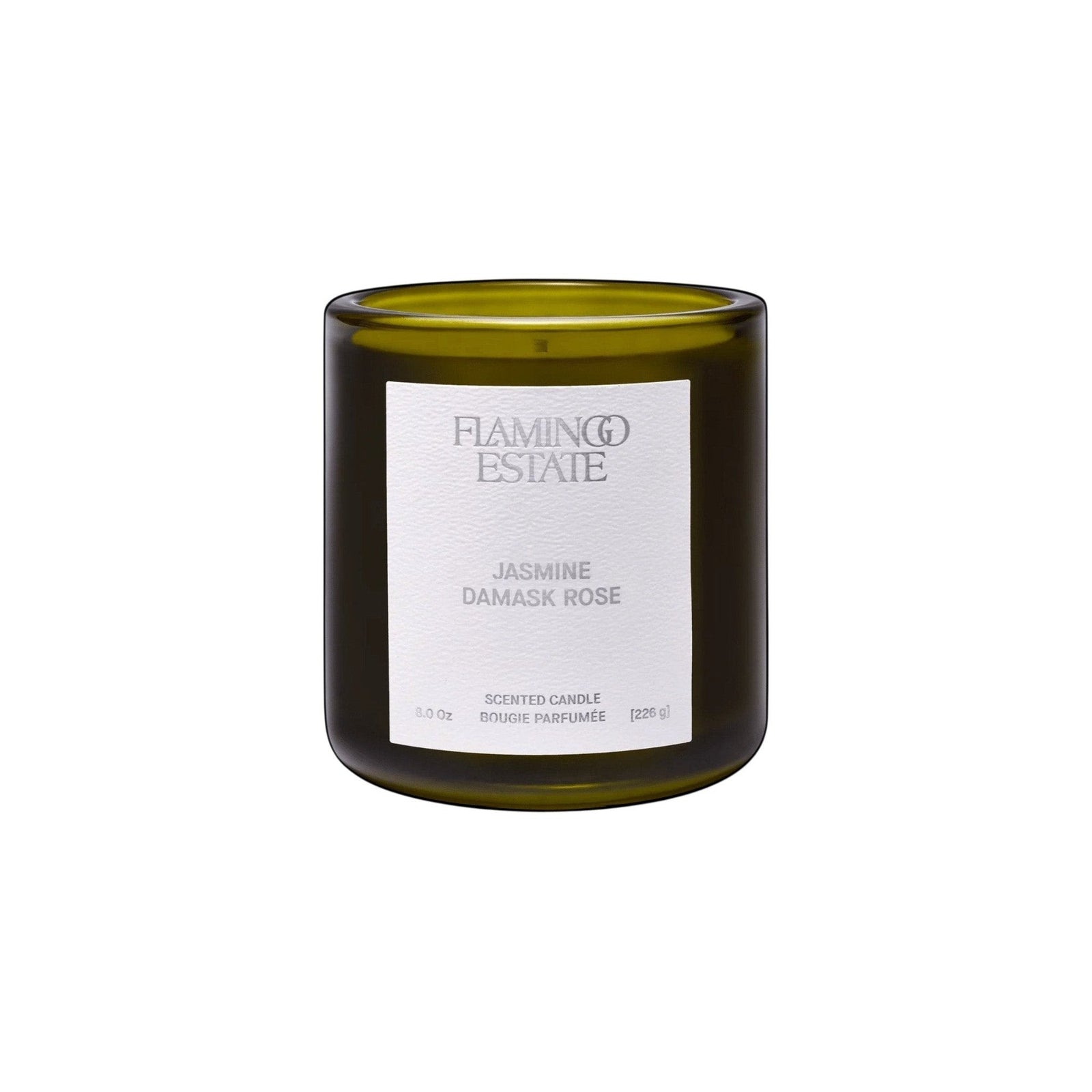 Flamingo Estate Jasmine Damask Rose scented candle in a forest-green glass vessel with a white label.