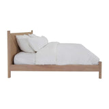 Calimia Home Kelma Bed in natural oak with a hand-woven paper cord headboard and white bedding, side view