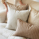 Walter G Kythira Washed Pista decorative throw pillows with textured patterns and stripes on a beige sofa