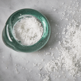Recycled glass salt dish styled with flaky sea salt