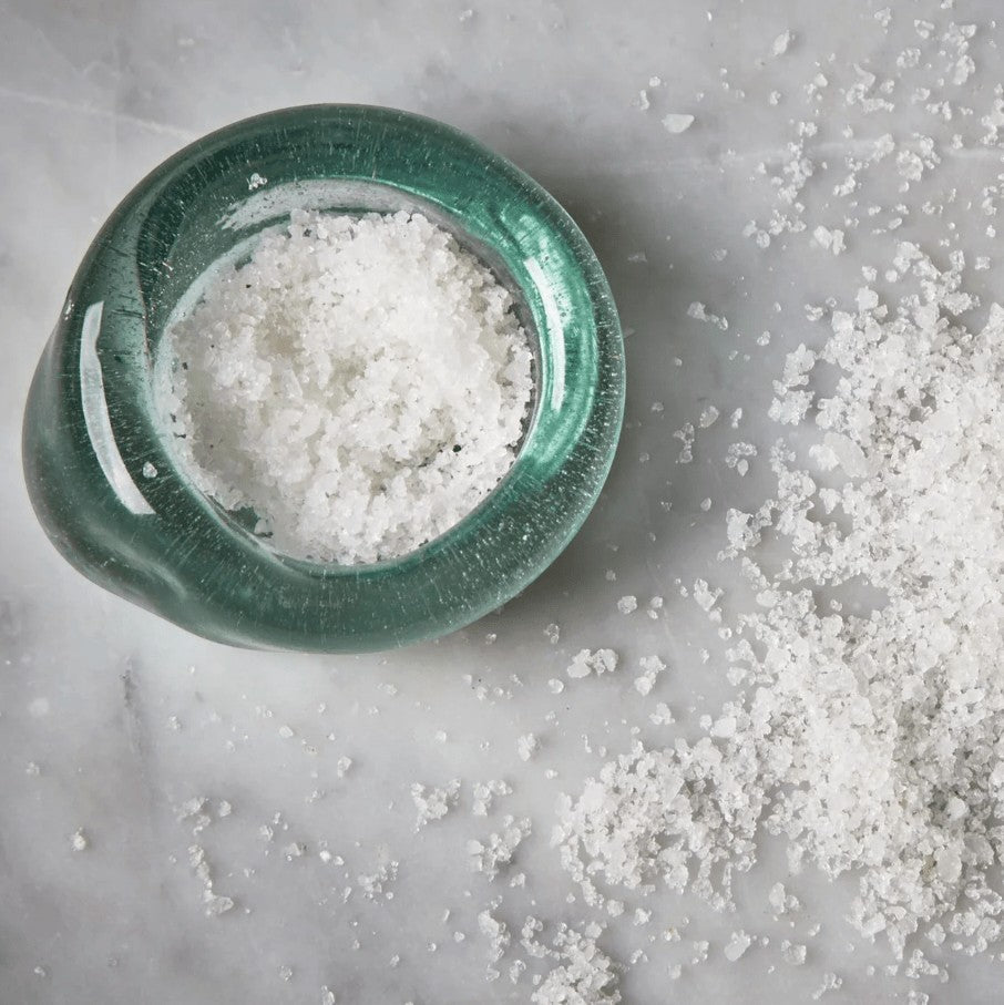 Recycled glass salt dish styled with flaky sea salt