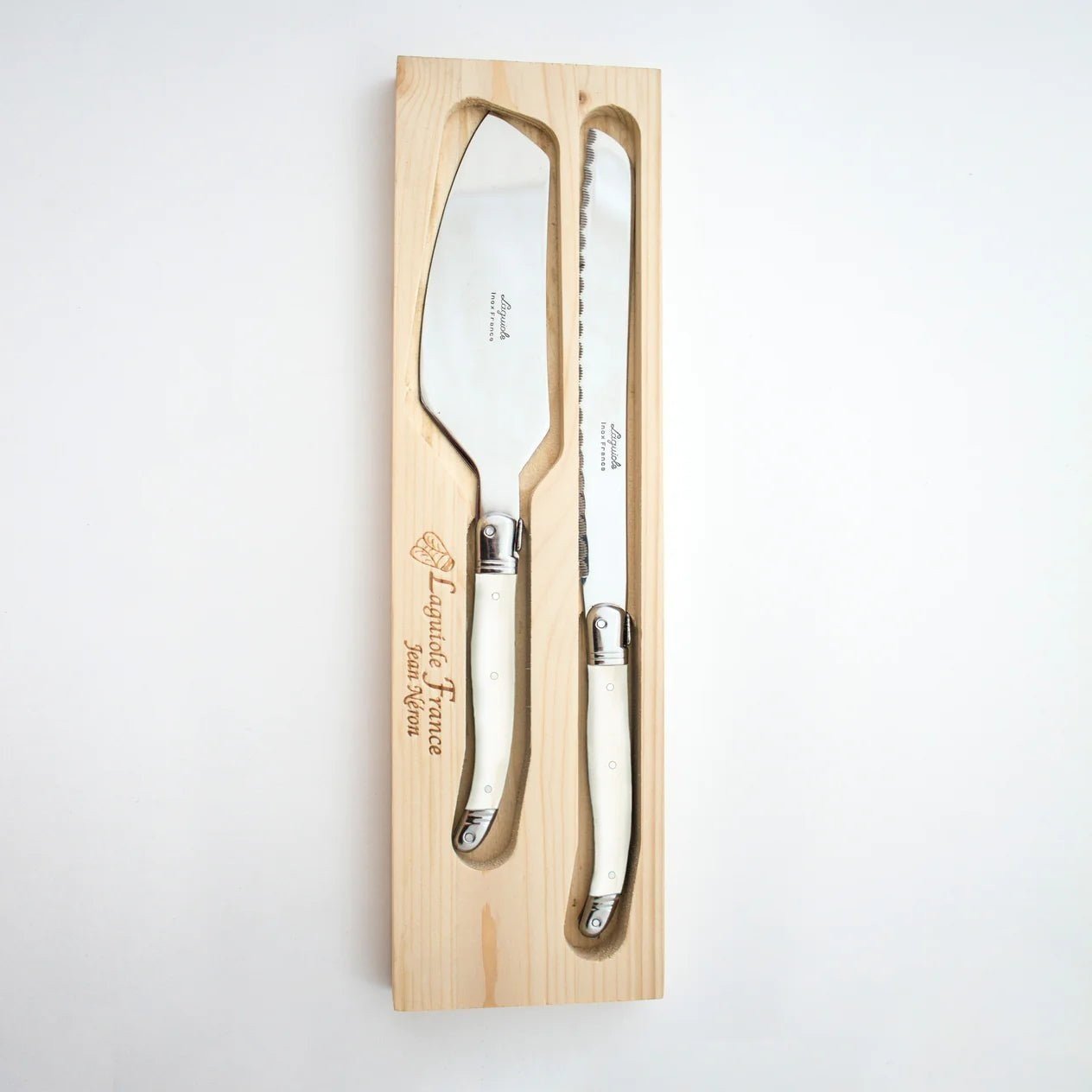 Calimia Home Laguiole ivory cake slicer and bread knife set with stainless steel blades in a wooden presentation box.