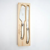 Calimia Home Laguiole ivory cake slicer and bread knife set with stainless steel blades in a wooden presentation box.