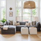 Calimia Home Landis Chaise Sectional in Zinc linen with a curved back, styled with neutral pillows in a bright room.