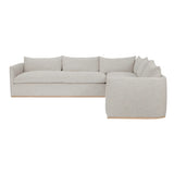 Calimia Home Landis left-facing sectional sofa in haze Belgian linen with a curved back and seamless bench cushions.