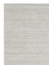 Armadillo Latitude Rug in Beluga, corner close-up of the linen pile and edge