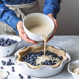 Farmhouse Pottery Laurel Pie Dish with baked pie, stoneware