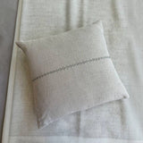 Calimia Home Lea beige Belgian linen pillow with subtle hand-embroidered line detail and soft textured finish.