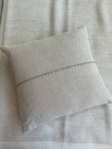 Lea Pillow by One Bi One — natural beige Belgian linen with hand-embroidered line pattern, 17 × 16 in, handcrafted in Gothenburg, Sweden