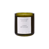 Flamingo Estate Leather Appointment candle in a forest-green fluted glass vessel with a white label.