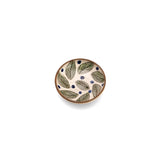 Small ceramic plate with leaf pattern on a white background