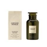 Caroline Francis Love My Life Bath Salts bottle beside its embossed cream box, which lists jasmine, rose, and cedarwood essential oils.
