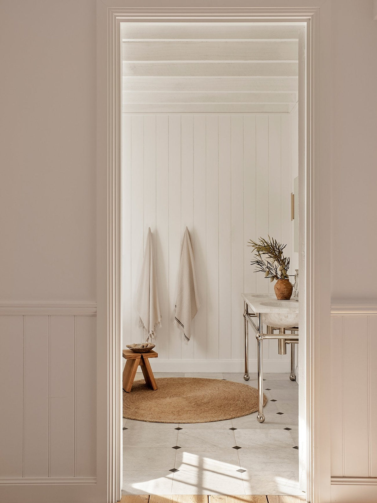 Lucine Nook Rug by Armadillo, hand-braided jute rug, styled in a room at Calimia Home
