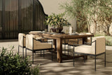 Lumi outdoor dining table on a patio with Lumi dining chairs