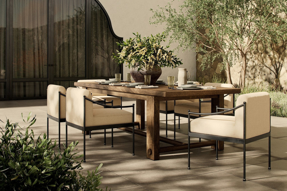 Lumi outdoor dining table on a patio with Lumi dining chairs