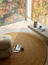 Armadillo Luna Rug in Dijon, a second view of the hand-braided wool rug in a styled interior
