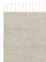 Armadillo Malawi Rug in Oatmeal, corner close-up of the wool pile and edge