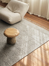 Armadillo Malawi Rug in Feather, a second view of the hand-knotted wool rug in a styled interior