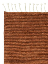 Armadillo Malawi Rug in Saffron, corner close-up of the wool pile and edge