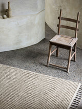 Armadillo Malawi Rug in Oatmeal, a second view of the hand-knotted wool rug in a styled interior