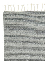 Armadillo Malawi Rug in Crane, corner close-up of the wool pile and edge