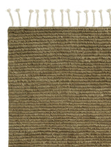 Armadillo Malawi Rug in Olive, corner close-up of the wool pile and edge