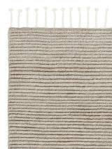 Armadillo Malawi Rug in Mushroom, corner close-up of the wool pile and edge