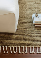 Armadillo Malawi Rug in Olive, overhead view of the hand-knotted wool weave and edge finish