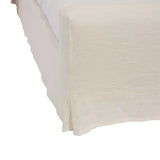 Calimia Home Mara Bed featuring a cream-colored, fully slipcovered frame with a tailored, relaxed aesthetic.