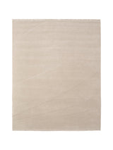 Armadillo Marea Rug in Vellum, a second view of the hand-knotted and hand-carved wool rug in a styled interior